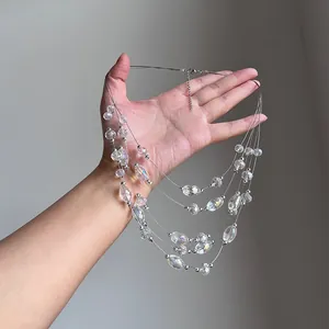Close-up view of multi-layered necklace with iridescent crystal beads on thin wires