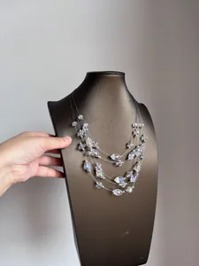 Close-up showing the shimmering beads of a multi-layered crystal beach necklace