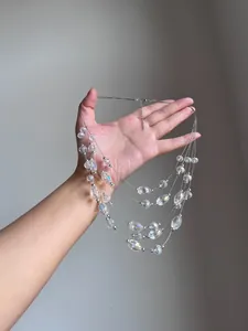 Detailed macro view of a multi-layer iridescent faceted crystal beaded necklace for summer