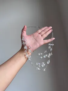 Detailed view of a multi-layer necklace with iridescent crystal beads and silver accents