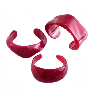 Three-piece set of irregular geometric acrylic marbled bangles in magenta pink finish