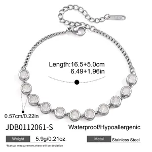 Close-up of stainless steel bracelet with circular crystals and size specifications