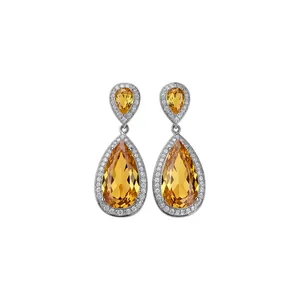 Elegant silver needle teardrop dangling earrings with sparkling yellow zirconia stones