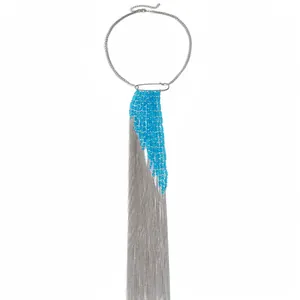 Exaggerated long tassel necklace featuring blue glass beads and silver metal chain fringe