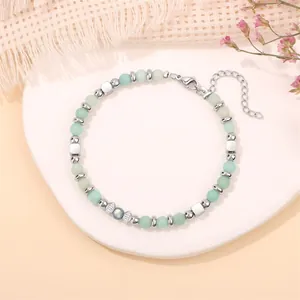 Detail of 4mm African pine and moonstone beaded bracelet with stainless steel accents