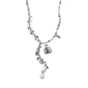 Elegant silver-tone necklace featuring a rhinestone money bag charm and large pearl pendant