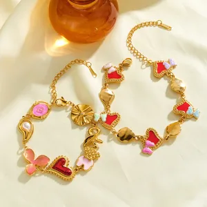Eleganti bracciali in acciaio inossidabile con ciondoli a cuore, fiocco, perla e smalto