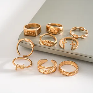 Detailed set of vintage gold-finished rings featuring leaf, antler, and braided designs.