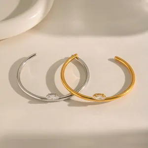 Elegante open armbanden van 18K goud en roestvrij staal met marquise-steen detail