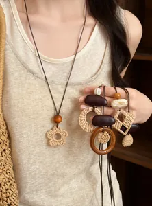 Close-up of handmade woven ethnic pendants in various geometric shapes for women