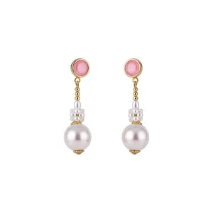 Elegant vintage style gold-toned pink stone and white resin pearl dangle earrings for women.