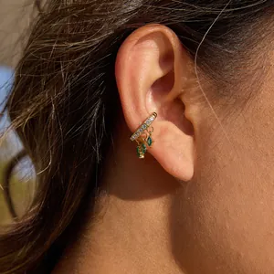 Elegant gold stainless steel ear cuff with zirconia and green marquise stone charms