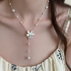 Elegant Korean style pearl flower pendant necklace with dainty pearls on neck detail