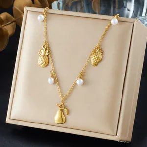 Gold-plated fruit charm necklace with pineapple, strawberry, pear charms and pearls