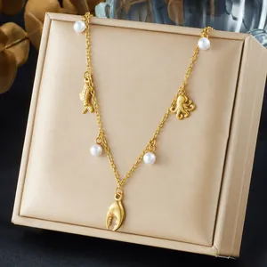 Gold plated stainless steel ocean necklace featuring pearls with octopus and fish charms