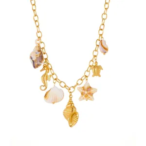 Gold plated beach style necklace with marine life charms like shells and starfish