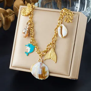 Gold-plated marine necklace with shell and dolphin charms for summer beach style