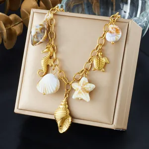 Gold ocean charm necklace featuring shell, starfish, and seahorse pendants for beach style.