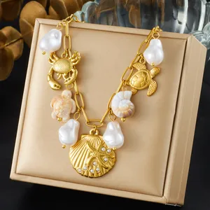 Gold plated ocean theme necklace with shell starfish turtle and baroque pearls on gift box