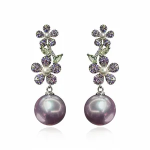 Boucles d'oreilles en argent avec zircons violets et grandes perles lavande