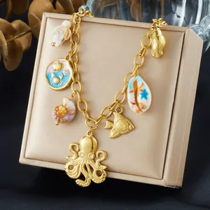 Beautiful gold plated marine life charm necklace with octopus, fish and shell pendants