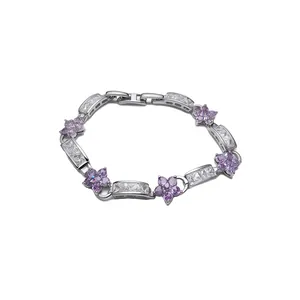 Elegant silver-tone clasp bracelet with purple zircon flowers and clear gemstones