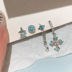 Exquisite silver needle earrings set with light blue zircons, stars and cross pendants