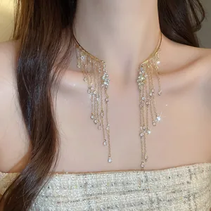 Detail of sparkling crystal tassel choker with angel wing inspired design for women.