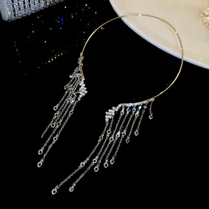 Macro detail view of a shimmering silver-tone choker necklace with elegant crystal fringe tassels