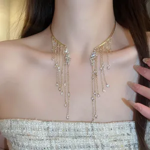 Detail view of a sparkling crystal tassel choker featuring a luxury angel wing design.