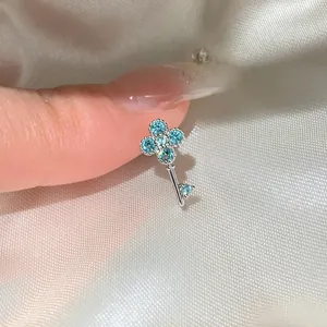 Exquisite silver key stud earring featuring a delicate blue zircon flower design
