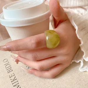 Elegant green transparent marbled resin ring with thick irregular texture for women