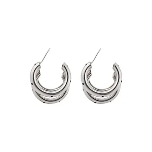 Brushed silver-tone C-shaped earrings with unique three-layer polka dot design
