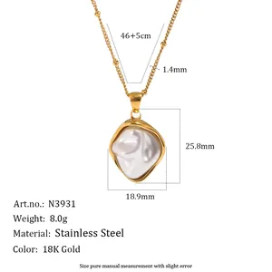 Detailed view of the irregular pearl pendant on an 18K gold plated stainless steel necklace