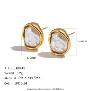 Detailed view of irregular 18K gold plated stainless steel pearl earrings with specs