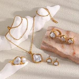 Detailed view of French retro 18K gold plated jewelry set with irregular baroque pearls