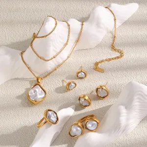 Macro view of vintage 18K gold plated jewelry set with irregular baroque pearls