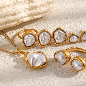 Detail of vintage irregular baroque pearl jewelry set in 18K gold plated stainless steel