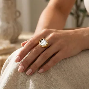 Elegant close-up of a vintage 18K gold plated irregular ring with baroque pearl