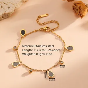 Detailed view of a gold teardrop charm anklet showing material, length, and weight specs