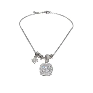 Elegant silver-toned necklace featuring a cushion-cut zircon pendant with halo