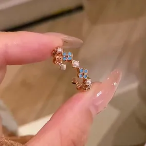 Close-up detail of vintage French style turquoise flower ring with pearl accents