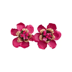 Vintage fuchsia enamel flower stud earrings with intricate gold floral centers