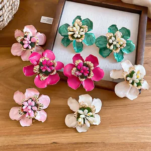 Exquisite detailed view of retro enamel flower stud earrings in various elegant colors.