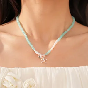 Mintgroene glazen kralenketting met een delicate zilveren zeester en schelphanger voor dames