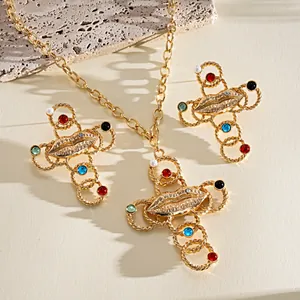 Retro gold-toned cross jewelry set featuring lip motif and colorful resin accents