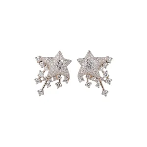 Elegant star-shaped stud earrings with shooting star accents and clear cubic zirconia stones.