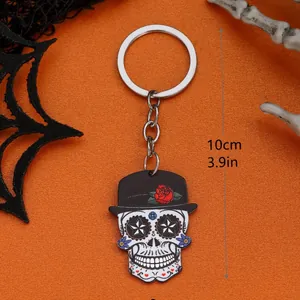 Detail of Day of the Dead skull keychain with red rose hat and 10cm measurement
