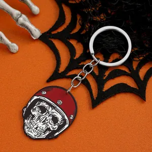 Gothic acrylic skull keychain with red vintage helmet on spooky Halloween spiderweb