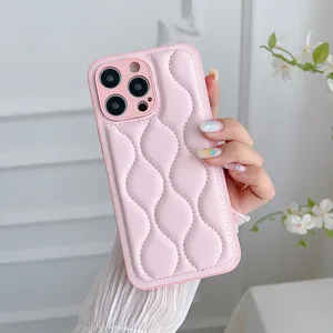 Close-up of pink quilted puffer texture leather case for iPhone with wave patterns